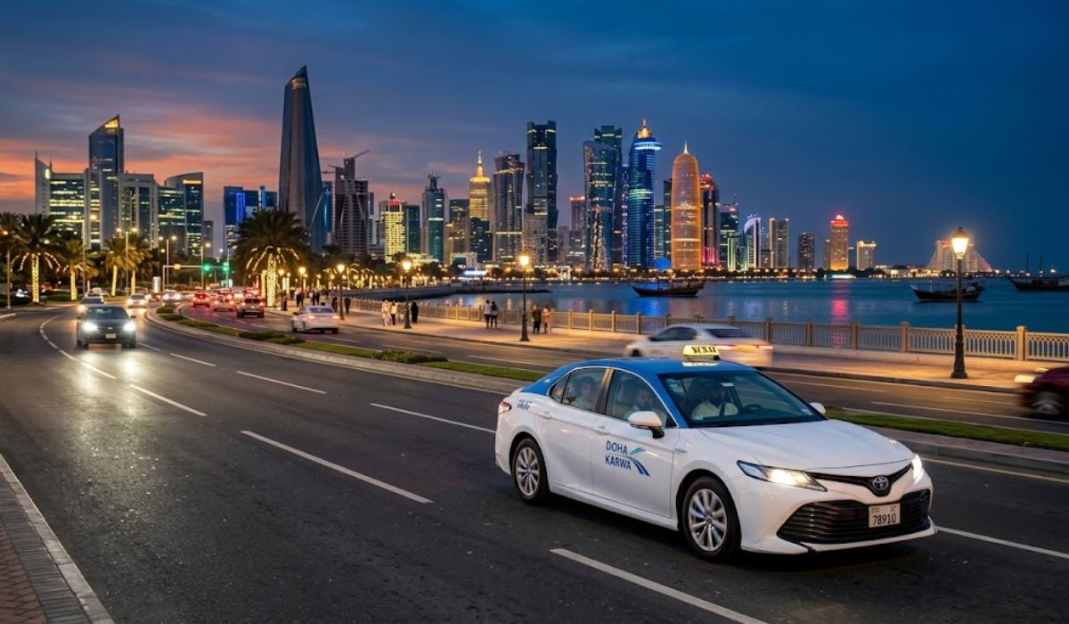 Reliable Qatar taxi service driving along Doha Corniche at sunset
